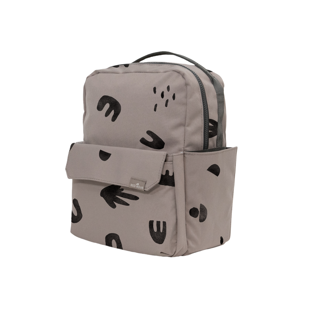 Perfect for little adventures, the Little Unicorn Red Rovr Mini Roo Backpack in Truffle Doodle is a comfortable and stylish kid backpack.