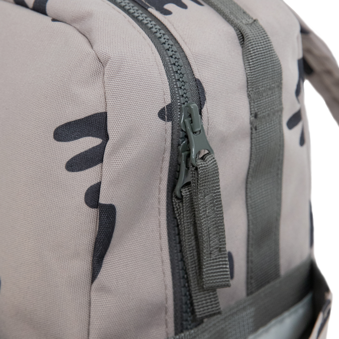 Compact and lightweight, the Little Unicorn Red Rovr Mini Roo Backpack - Truffle Doodle is thoughtfully designed as a backpack for kids.