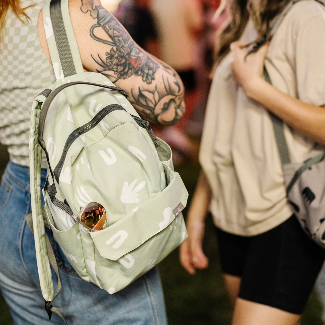 Interior view of the Little Unicorn Red Rovr Mini Roo Backpack in Pear Doodle, ideal for everyday adventures as a kids travel backpack.