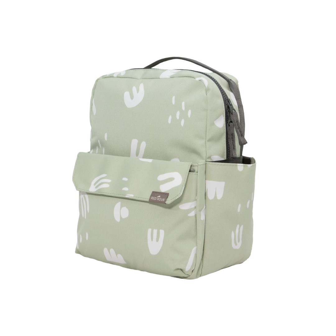 Designed for comfort and function, the Little Unicorn Red Rovr Mini Roo Backpack in Pear Doodle is a top-rated kid backpack.