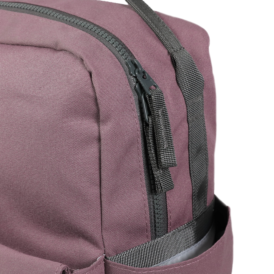 Close-up of Little Unicorn Red Rovr Mini Roo Backpack - Mauve, premium materials make it one of the best kids backpacks.
