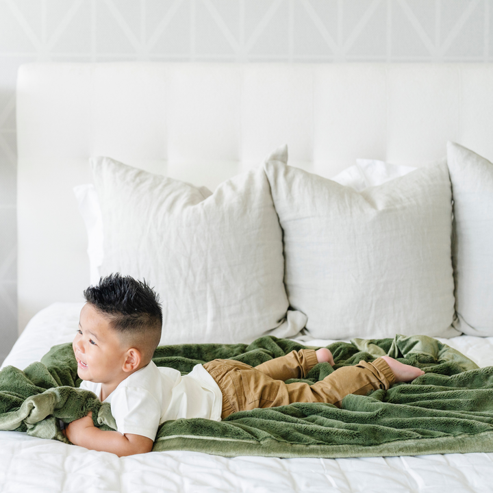 Keep your infant wrapped in the Fern Green Saranoni Lush Receiving Blanket, one of the best baby blankets.