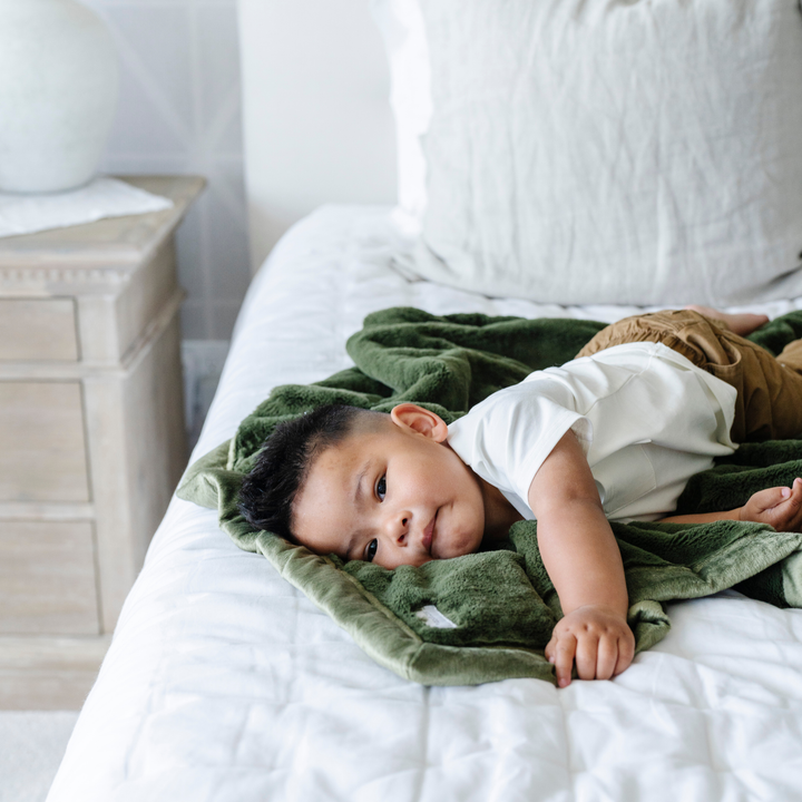 Gentle warmth comes from the Fern Saranoni Lush Receiving Blanket, a cozy baby boy blanket for little ones.