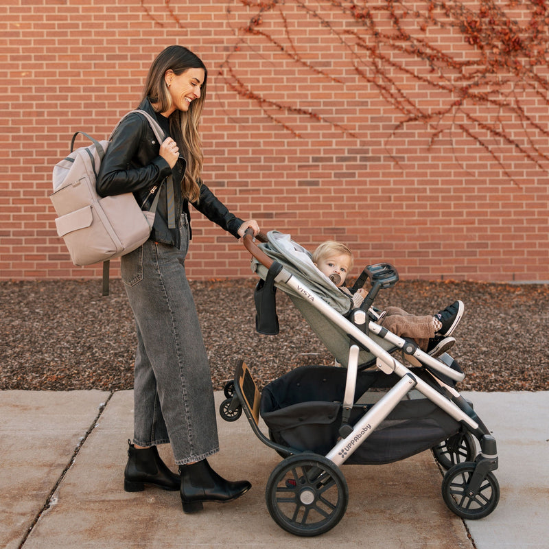 Little Unicorn Red Rovr Roo Backpack in Truffle shown with open compartments, ideal for a kids travel backpack.