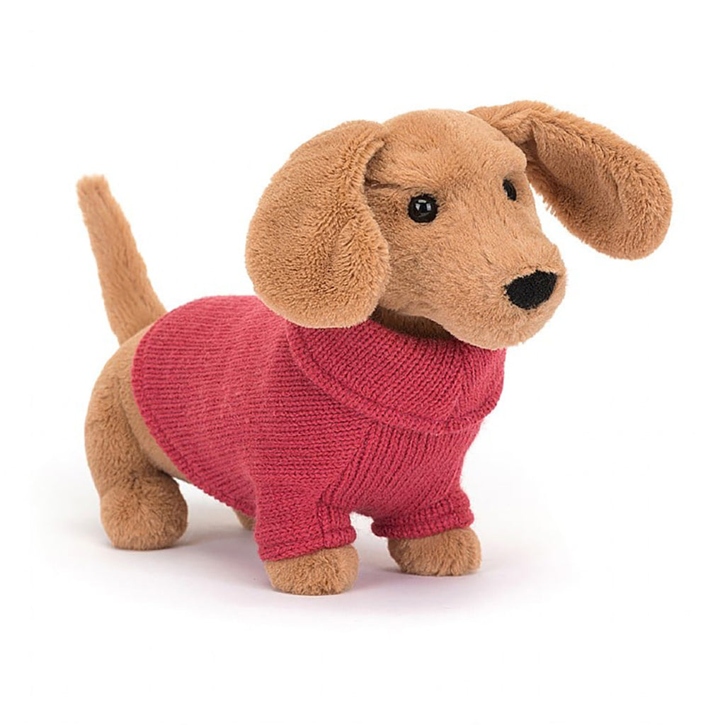 sausage dog stuffed animal in pink sweater