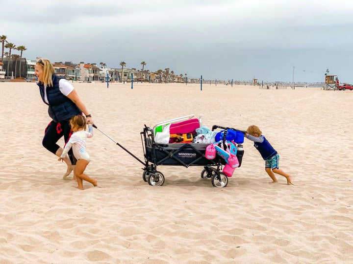 family on beach with wonderfold s4 wagon