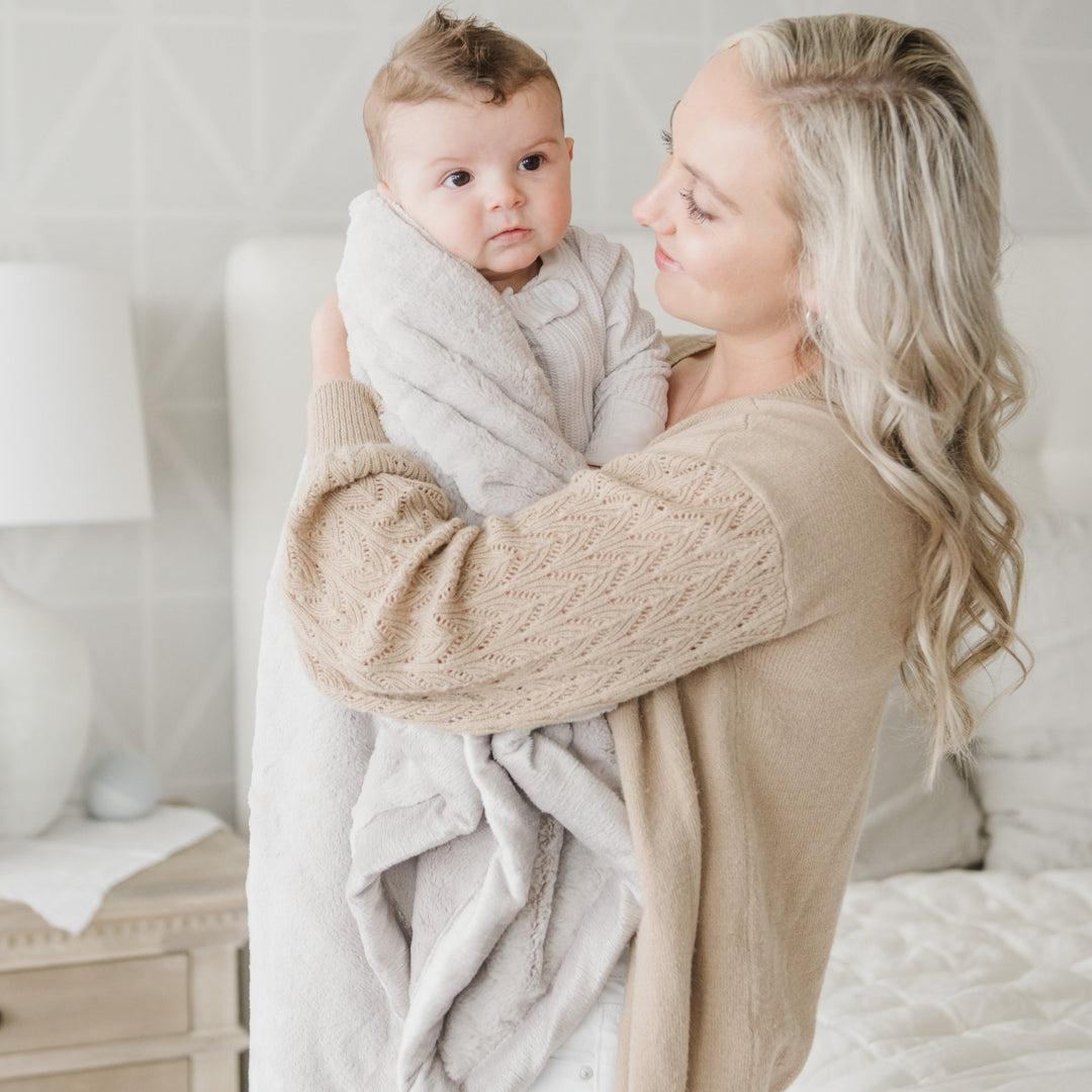 The Feather Saranoni Lush Receiving Blanket keeps babies comfy, ideal as a best blanket for toddler.