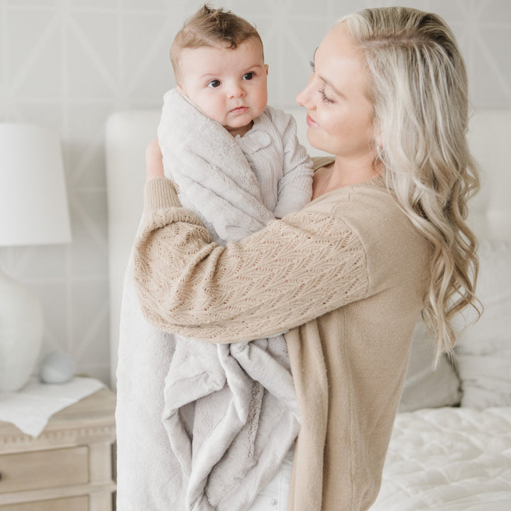 The Feather Saranoni Lush Receiving Blanket keeps babies comfy, ideal as a best blanket for toddler.