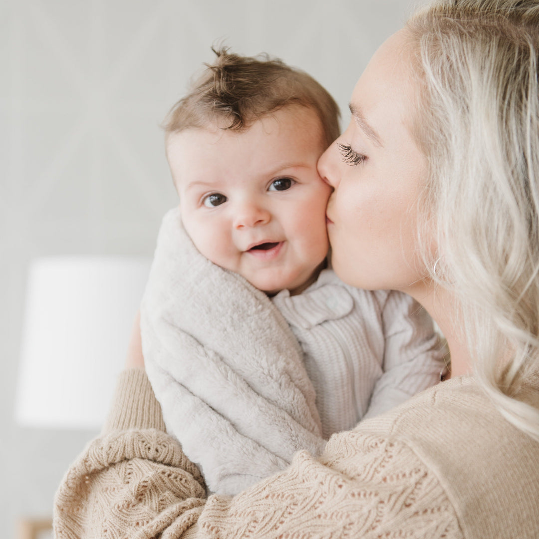 Cuddle-ready Feather Lush Receiving Blanket by Saranoni, plush and warm as one of the best toddler blankets.