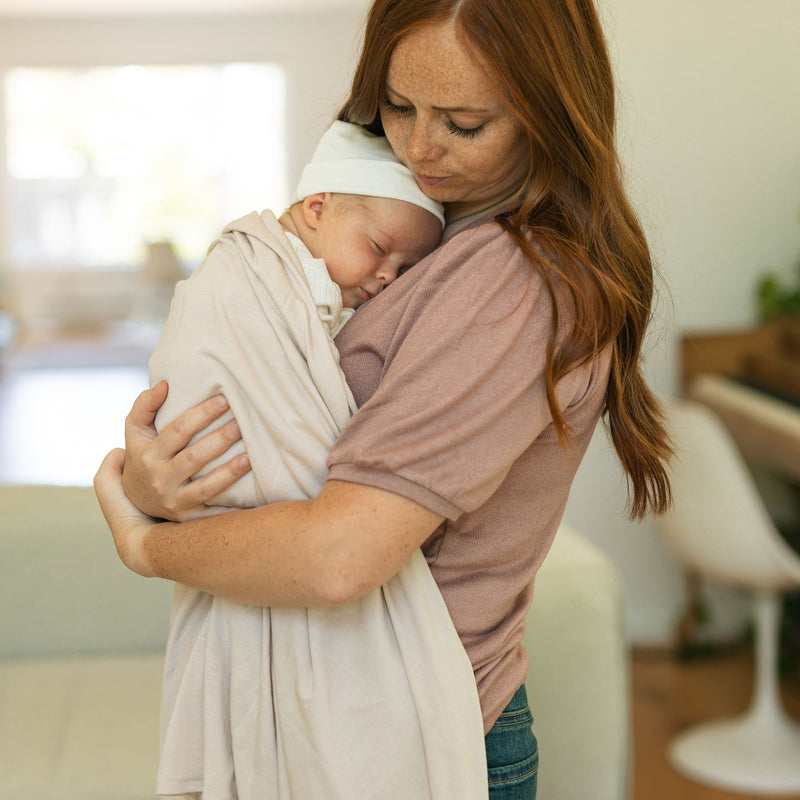 Wrap newborns gently with Little Unicorn Soft Blush Stretch Knit Swaddle Blanket, perfect muslin swaddle.