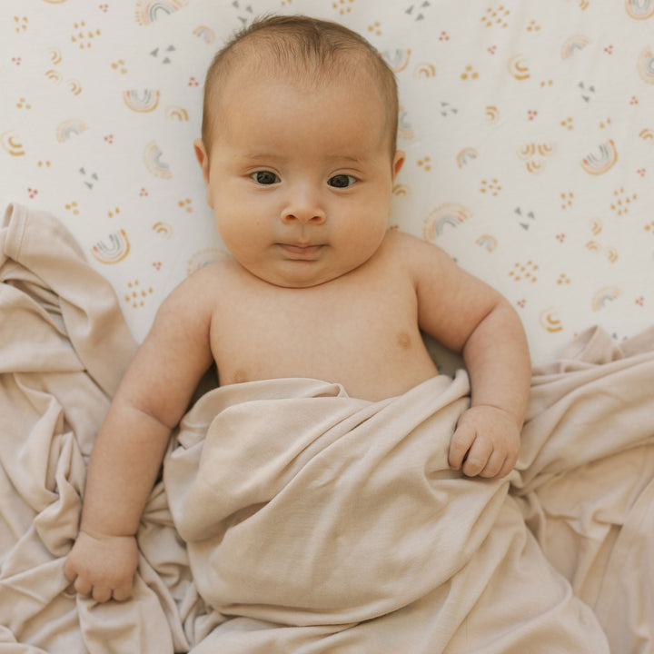 Little Unicorn Stretch Knit Swaddle Blanket in Soft Blush, versatile swaddle cloth muslin.