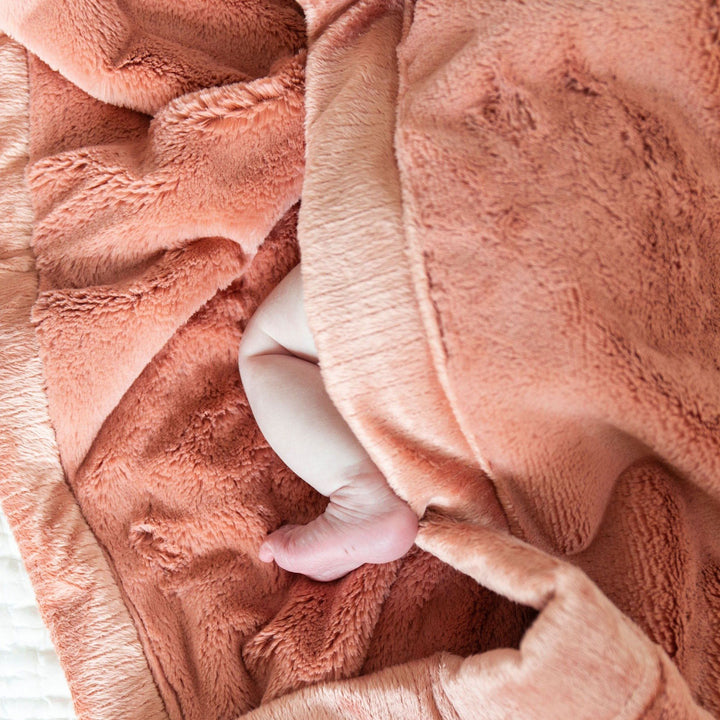 Infants stay snug with Clay Saranoni Lush Receiving Blanket, soft and cozy as a receiving blanket.
