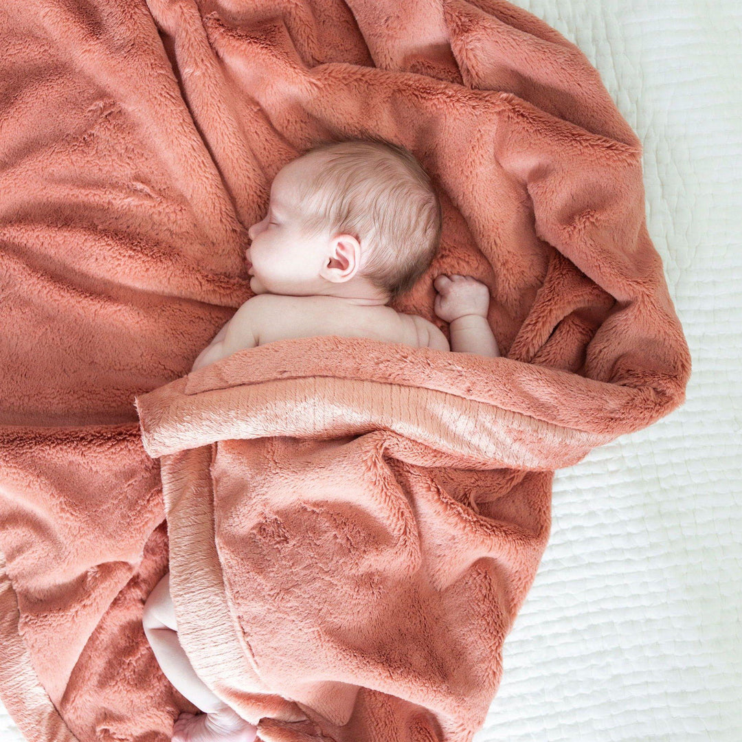 Wrap little ones in Clay Saranoni Lush Receiving Blanket, warm and plush as infant receiving blankets.