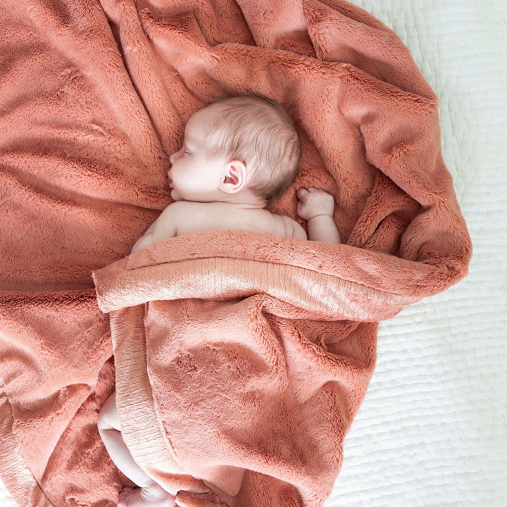 Wrap little ones in Clay Saranoni Lush Receiving Blanket, warm and plush as infant receiving blankets.