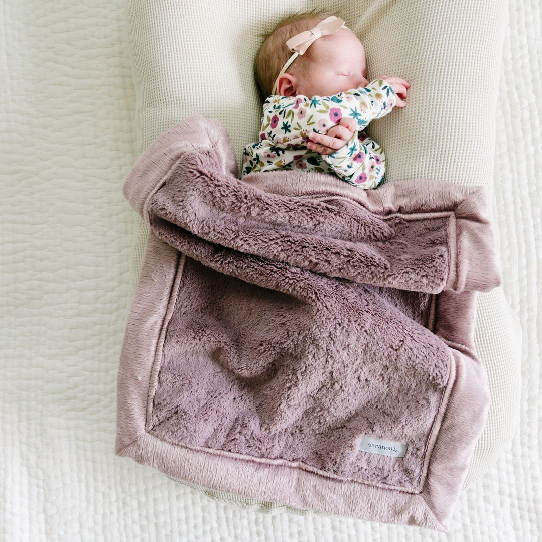 Saranoni Bloom Lush Mini Blanket adds dreamy warmth and an easy styling option for baby boy blanket must-haves.