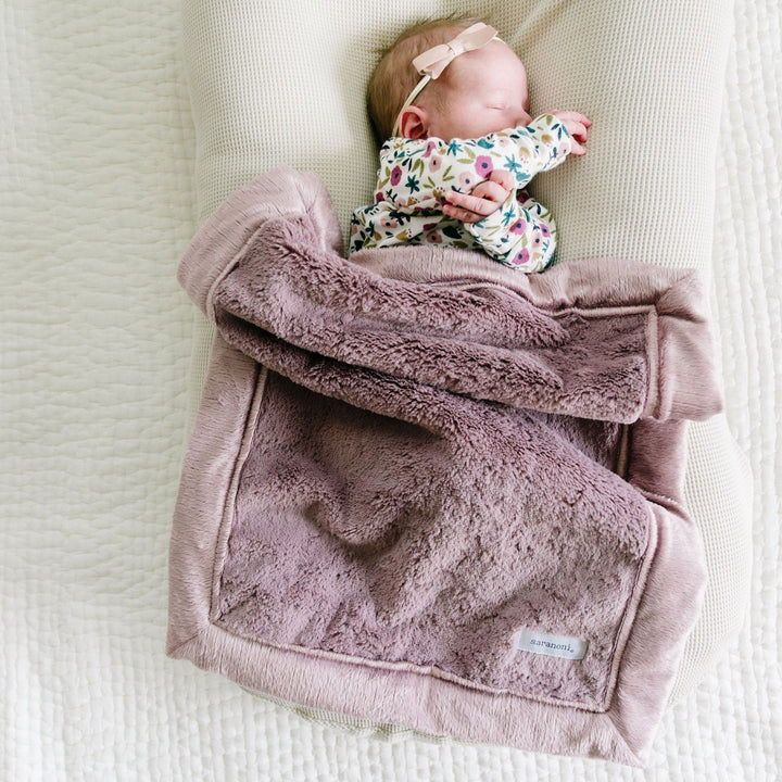 Saranoni Bloom Lush Mini Blanket adds dreamy warmth and an easy styling option for baby boy blanket must-haves.