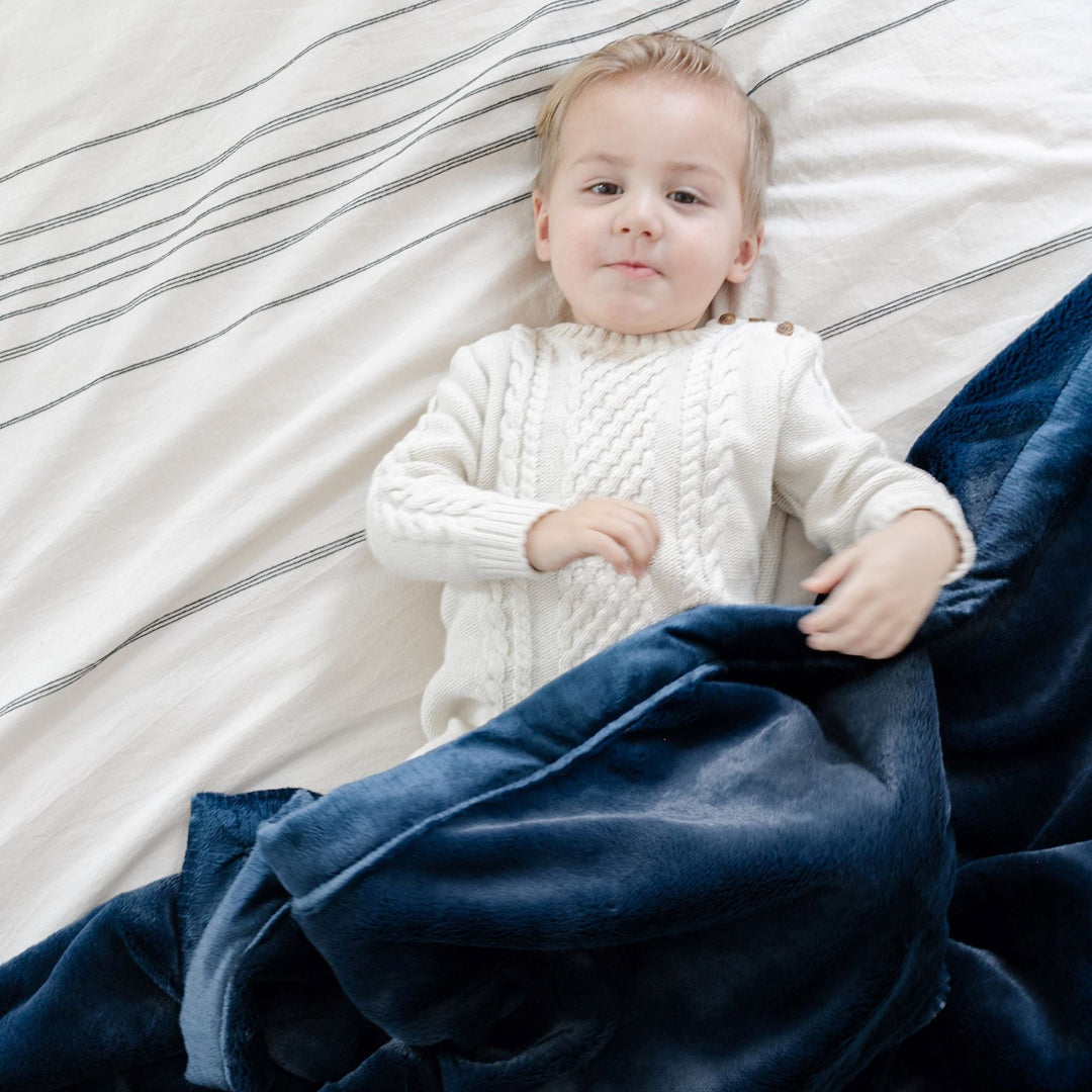 Keep infants cozy in Navy Saranoni Lush Receiving Blanket, ideal for naps as soft baby blankets.