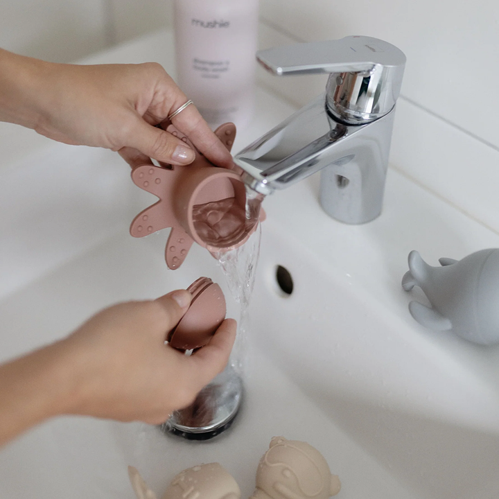 Tips for cleaning bath toys by Mushie, ensuring they stay mold-free and safe for toddlers.