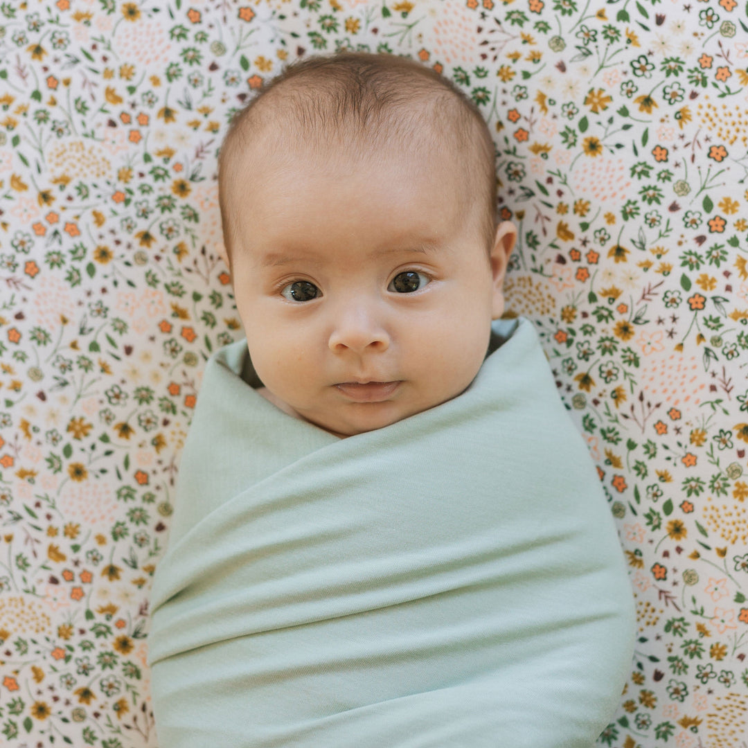 Soft and breathable muslin for swaddling, Little Unicorn Frost Green Stretch Knit Swaddle Blanket.