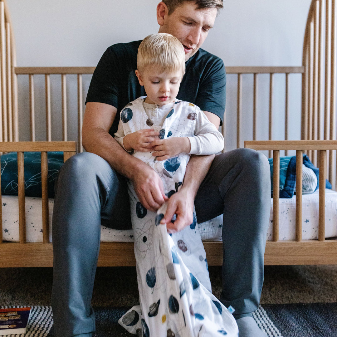 Little Unicorn Cotton Muslin Sleep Bag - Planetary fully extended, safe and cozy sleep bag baby for nighttime use.