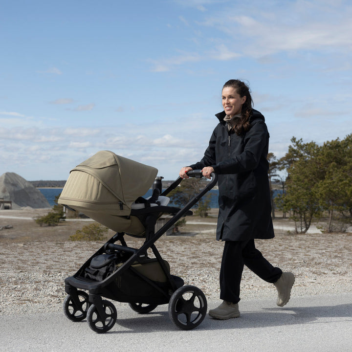 Lifestyle image of the Thule Charm Stroller | premium baby stroller