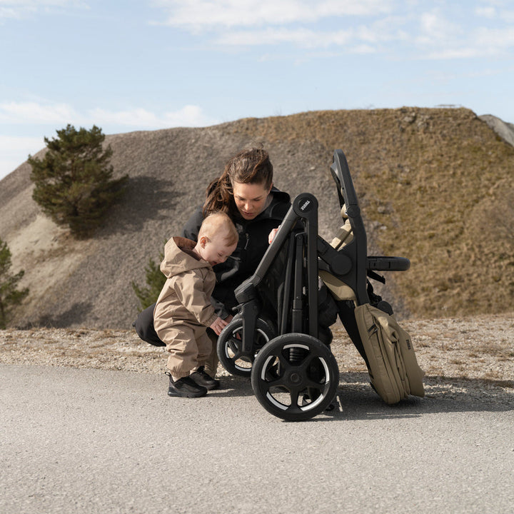 Thule Charm Stroller lifestyle photo, stroller w/ newborn insert