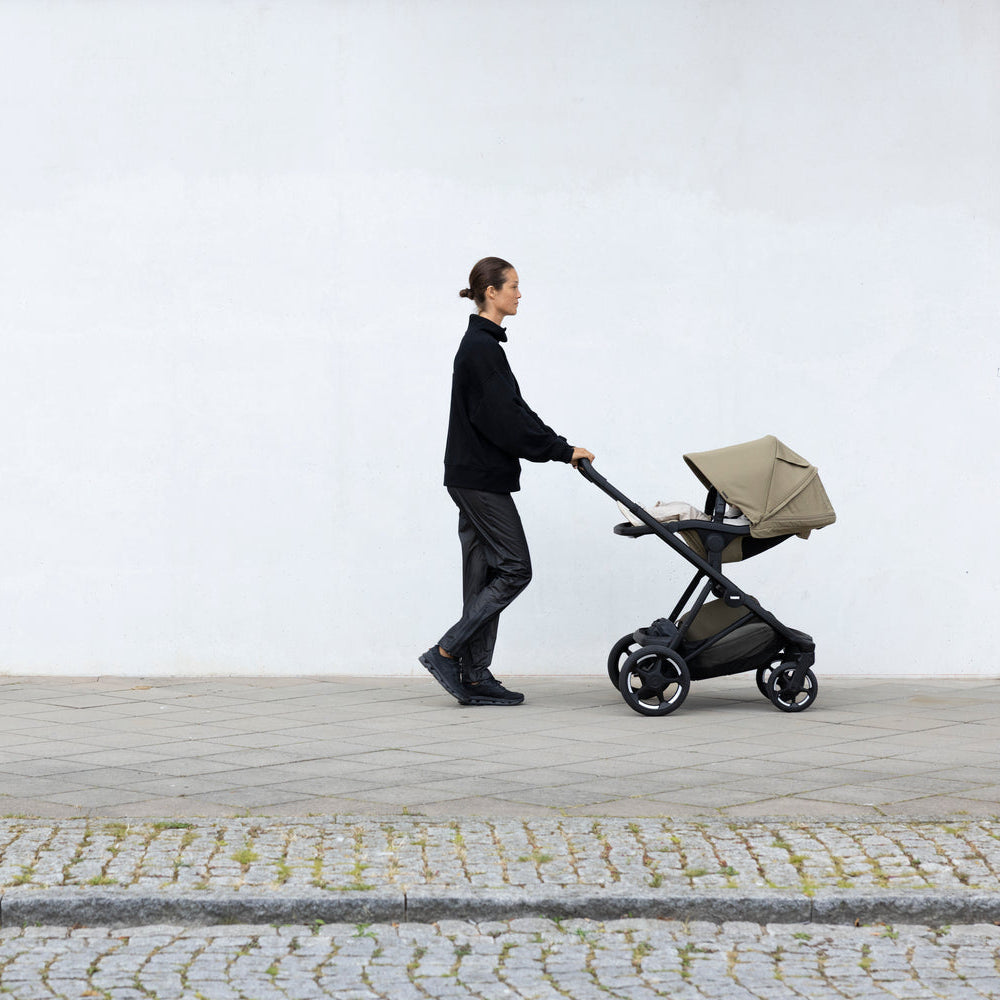 Full-size stroller from birth: Thule Charm Stroller in use outdoors