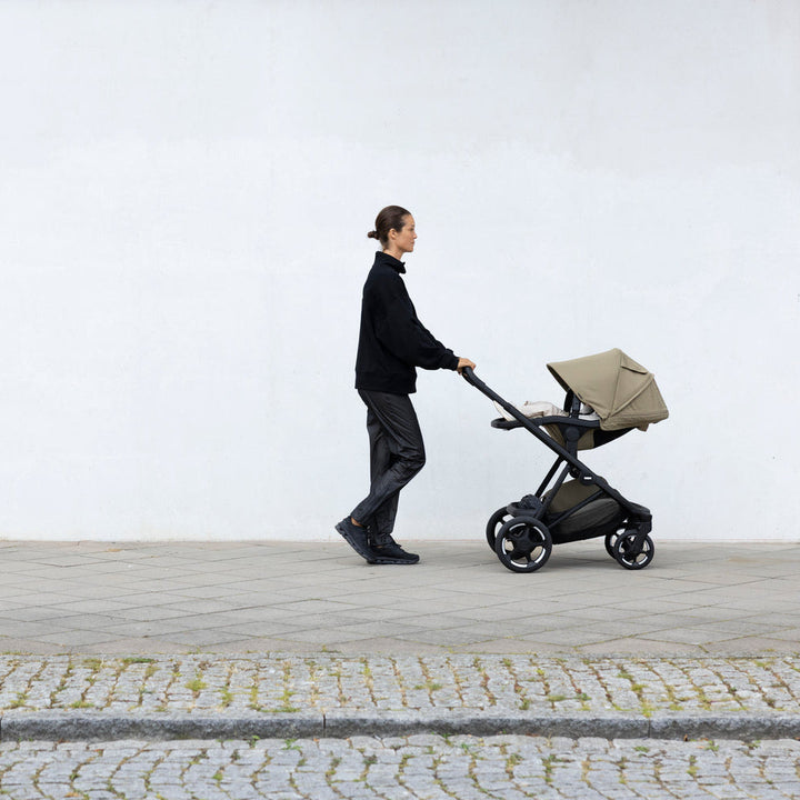Full-size stroller from birth: Thule Charm Stroller in use outdoors