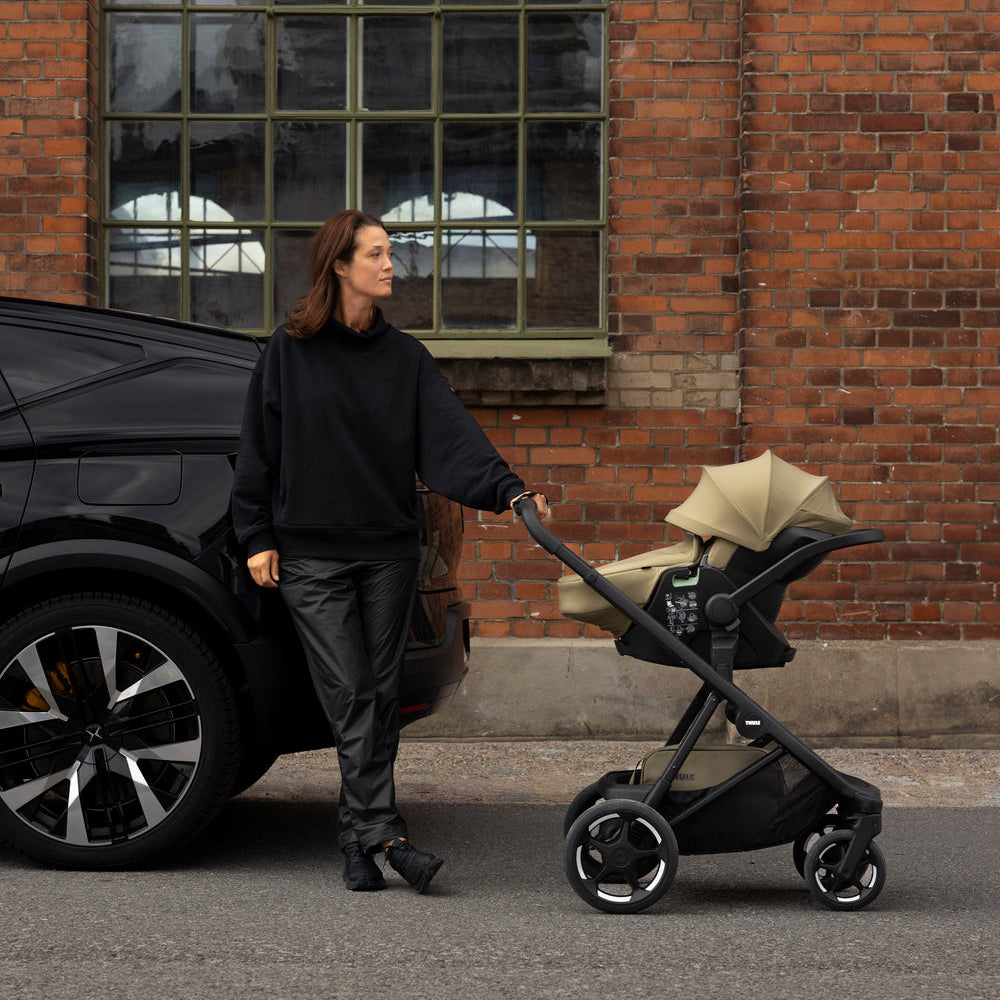 Thule Charm Stroller with Thule Maple infant car seat lifestyle photo, premium baby stroller
