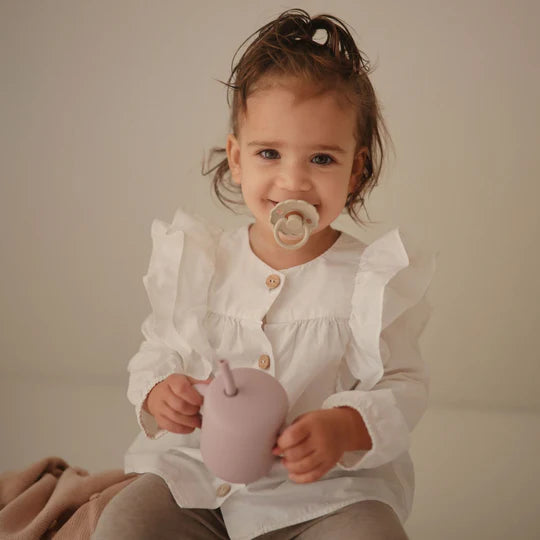 FRIGG Snowflake Dream natural rubber pacifier 4-pack size 1 front view - BPA-free latex soother in winter tones