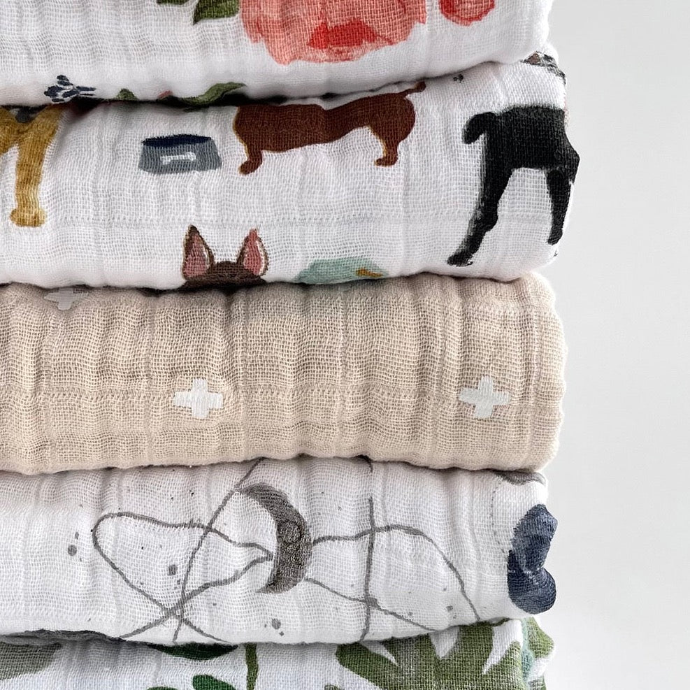 Stack of Little Unicorn Original Cotton Muslin Quilt - Woof and others, showcasing the brand’s premium handmade quilts collection.