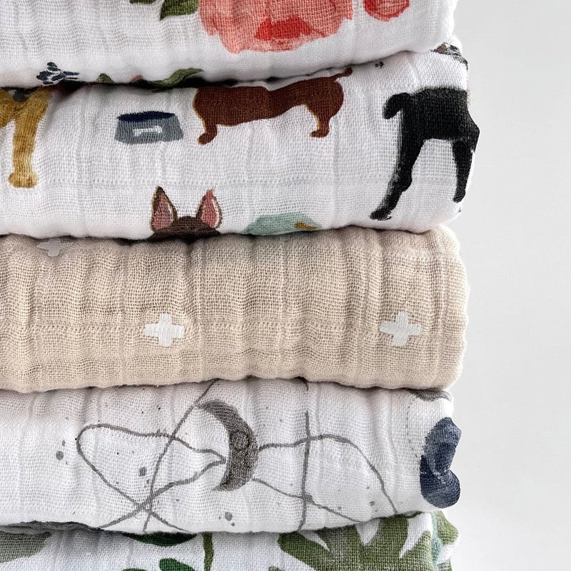 Stack of Little Unicorn Original Cotton Muslin Quilt - Woof and others, showcasing the brand’s premium handmade quilts collection.
