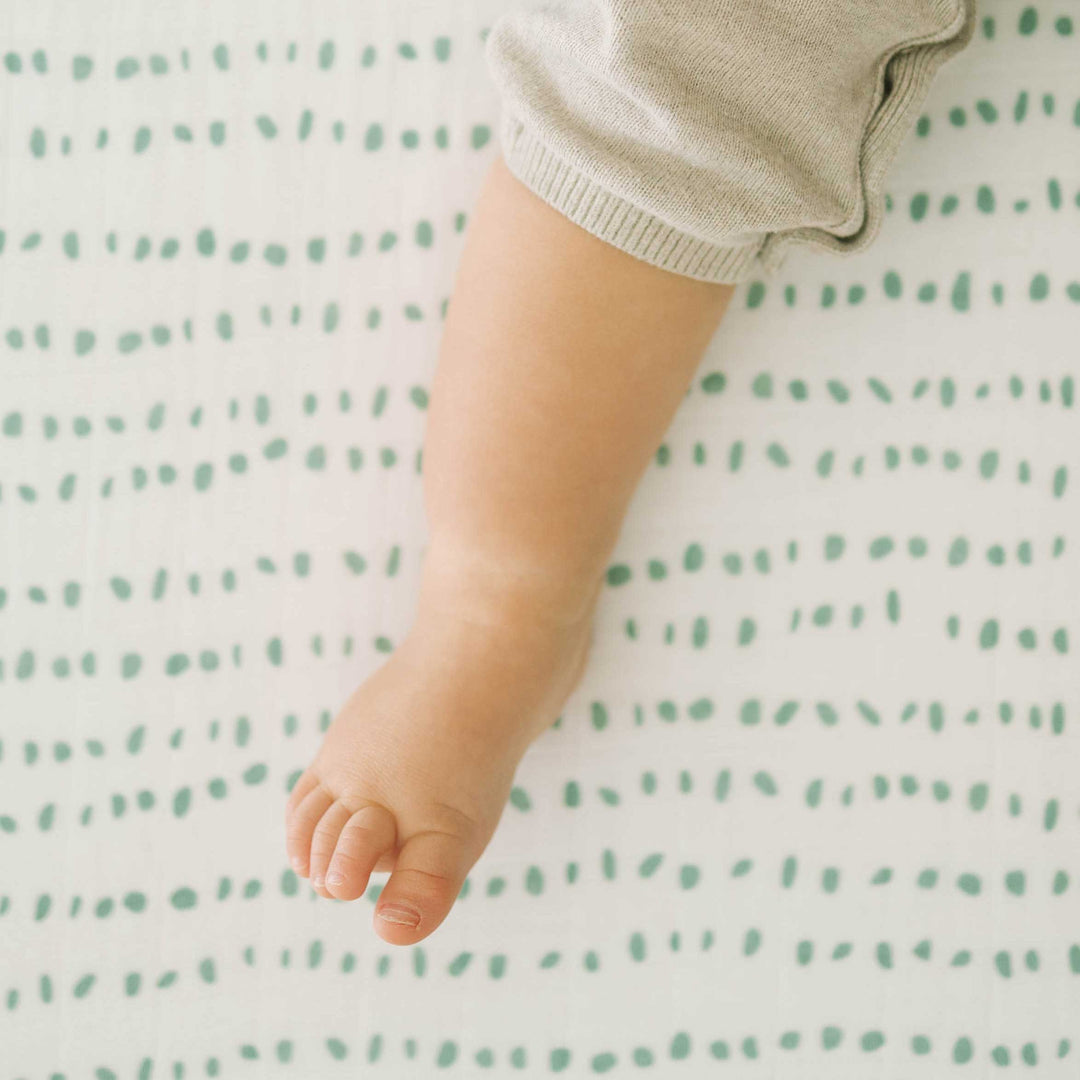 Crafted from lightweight muslin, the Little Unicorn Cotton Muslin Crib Sheet - Stone Stripe delivers the best crib sheets for sweet dreams.