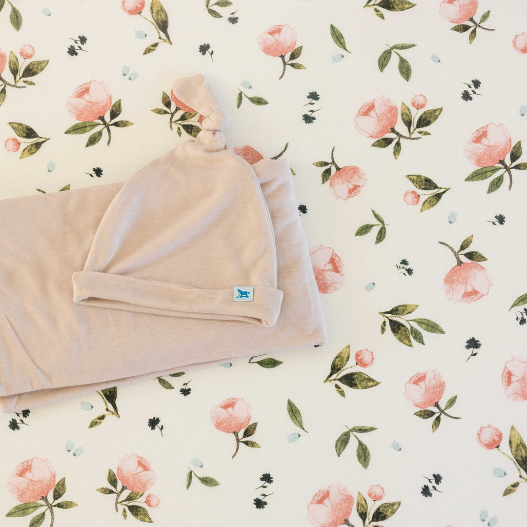 Floral pattern of the Little Unicorn Stretch Knit Crib Sheet - Watercolor Rose, a timeless pick for organic cotton crib sheets.