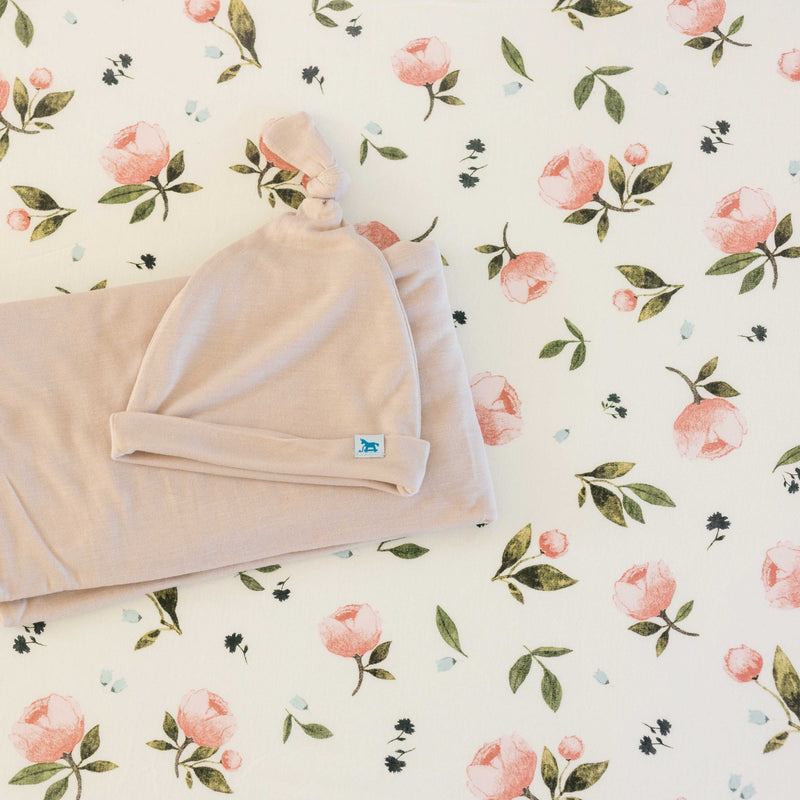 Floral pattern of the Little Unicorn Stretch Knit Crib Sheet - Watercolor Rose, a timeless pick for organic cotton crib sheets.