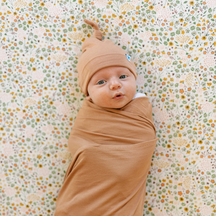 Terracotta muslin baby blankets from Little Unicorn, cozy Stretch Knit Swaddle Blanket for infants.