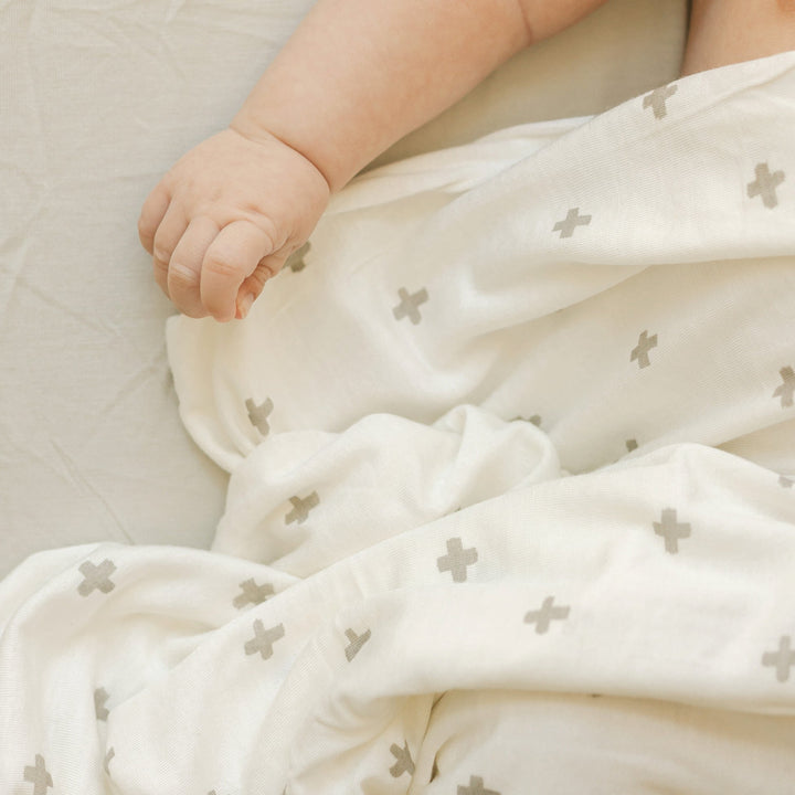 Infant muslin blankets by Little Unicorn, Stretch Knit Swaddle Blanket - Grey Cross, perfect for everyday swaddling