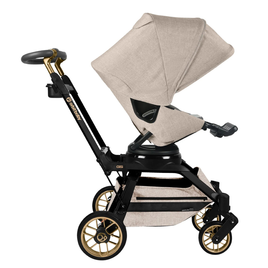 Orbit Baby Stroll & Ride Travel System in Melange Flax/Gold combines stylish design with practicality as a best stroller for toddler and infant.
