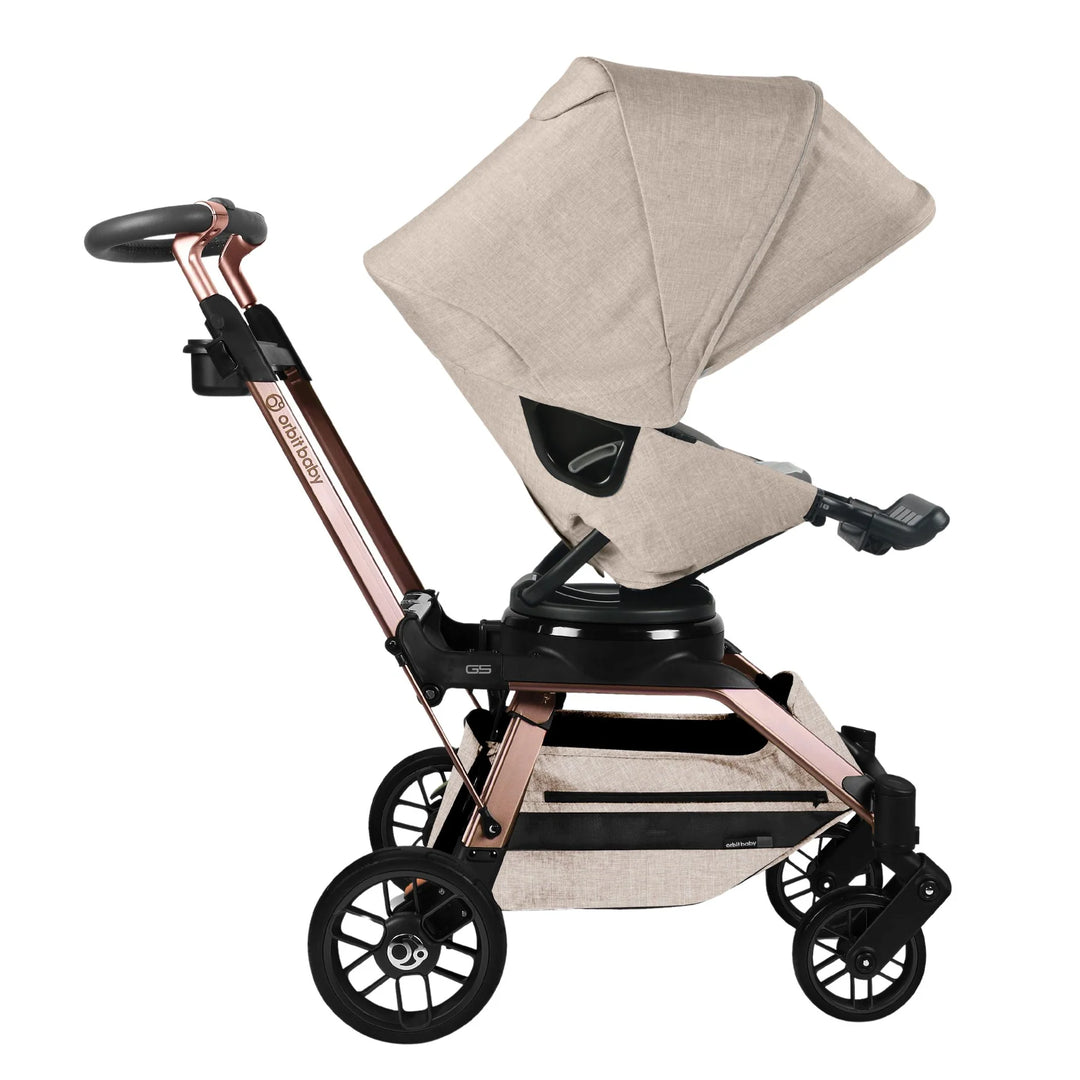 Orbit Baby Stroll & Ride Travel System in Melange Flax/Rose Gold offers a stylish and smooth stroller experience.