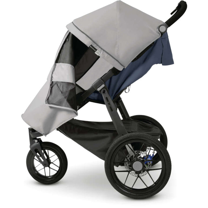 UPPAbaby Ridge Sun Bug Shield lifestyle — shade coverage during outdoor run