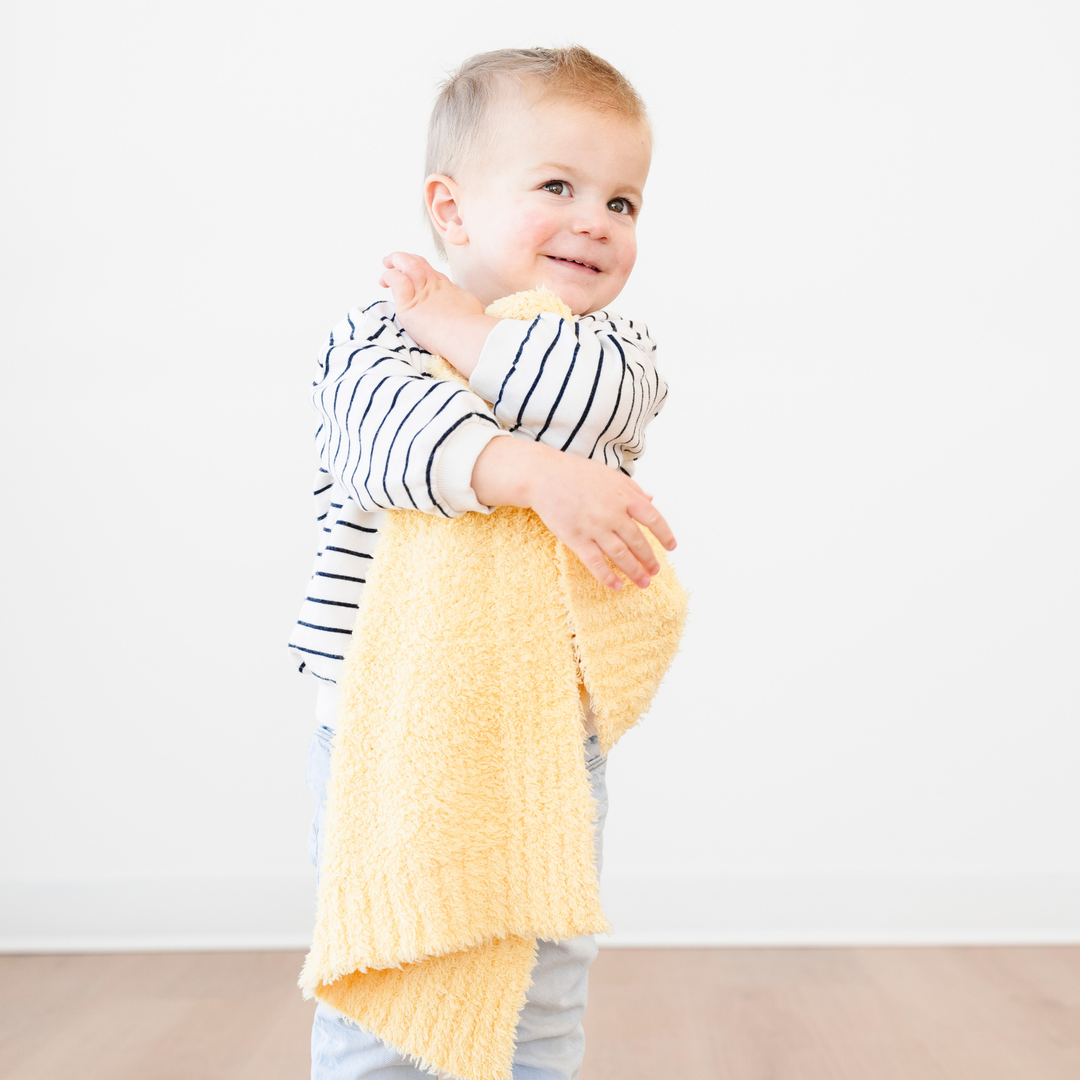 SaranoniÕs BAMBONI¨ Mini Blanket in Sunburst offers irresistible comfort, making it one of the best baby blankets for every season.