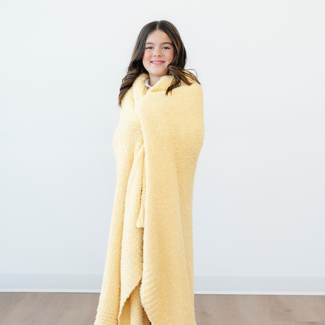 Wrap your toddler in Sunburst Saranoni BAMBONI¨ Toddler Blanket, warm and perfect as a best blanket for toddler.