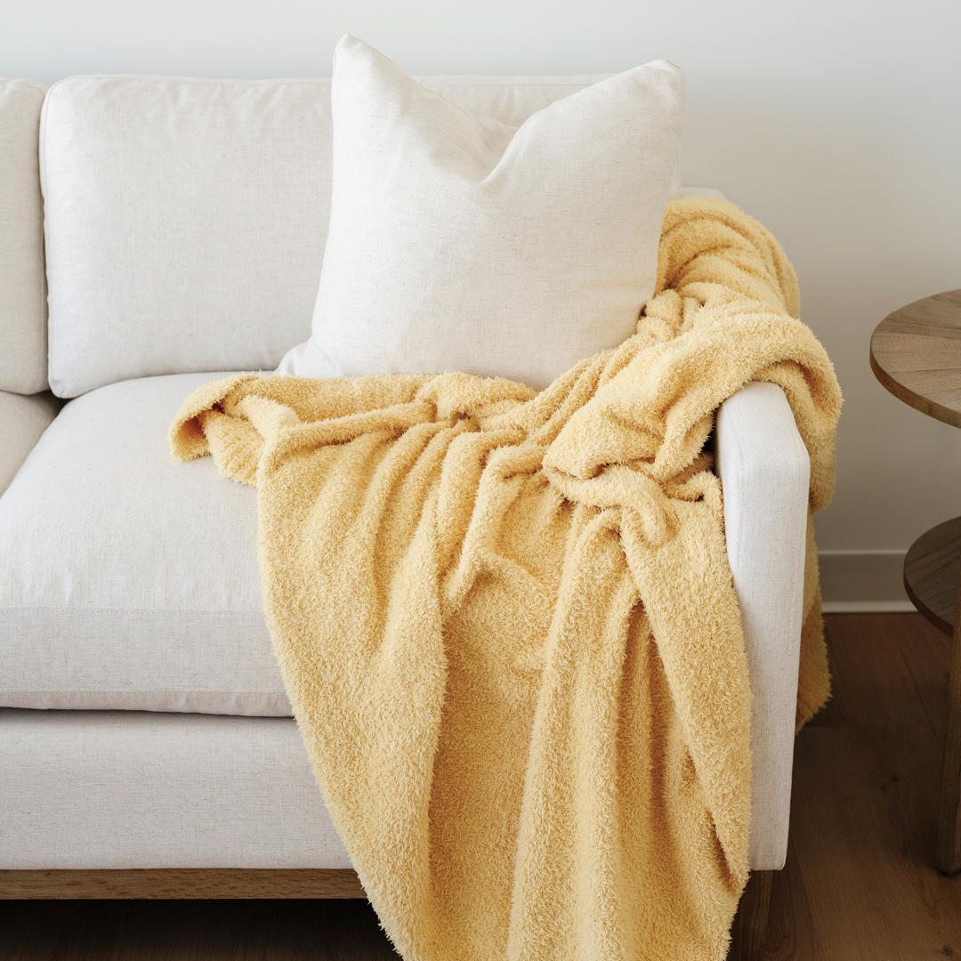 Soft and snuggly Sunburst BAMBONI¨ Toddler Blanket from Saranoni, one of the best toddler blankets.
