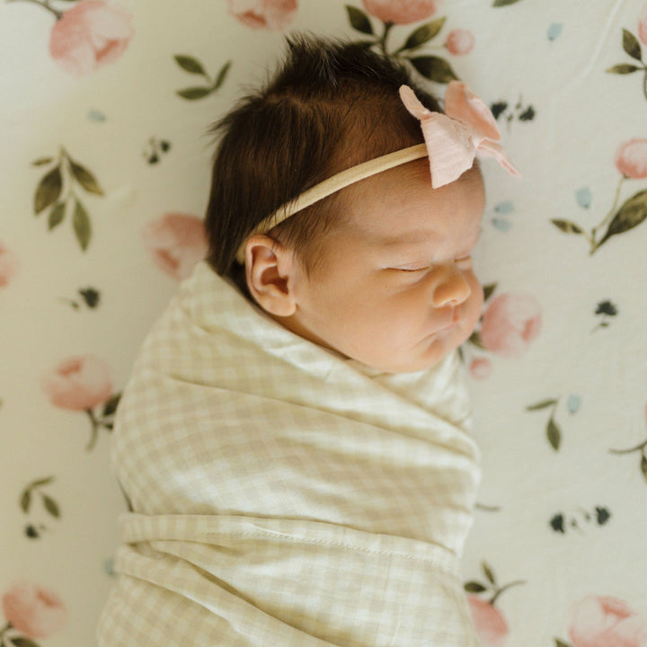 Tan Gingham muslin baby blankets from Little Unicorn, cozy Stretch Knit Swaddle Blanket for infants.