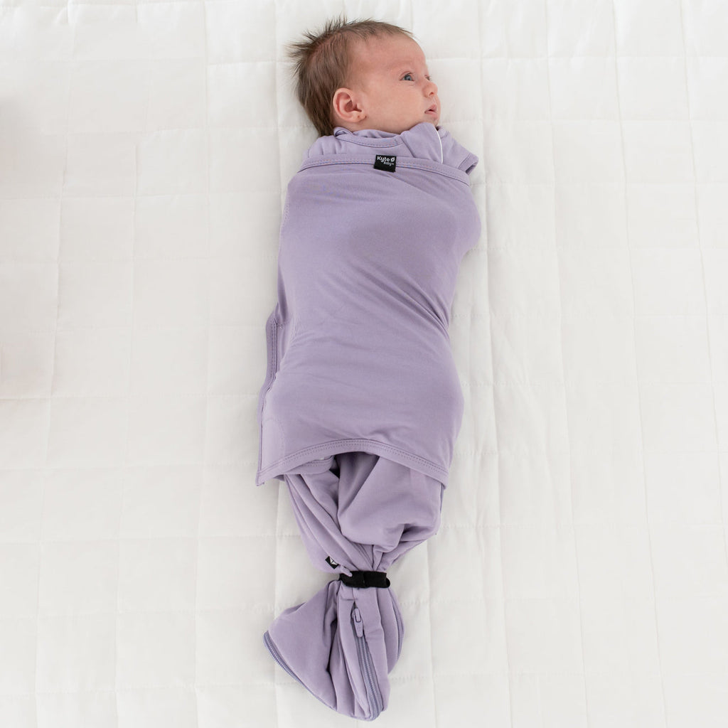 infant wrapped in taro baby sleep bag swaddler by kyte