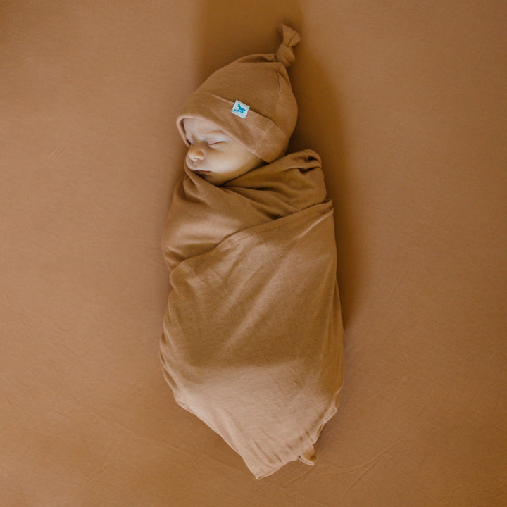 Soft and breathable muslin for swaddling, Little Unicorn Stretch Knit Terracotta Swaddle Blanket.