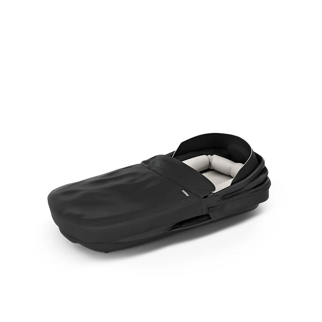 Thule black baby bassinet, designed to fit seamlessly with your Thule stroller.