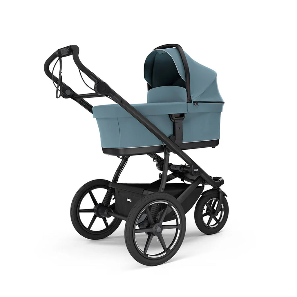 Thule Urban Glide 3 stroller with mid-blue bassinet, offering added comfort.