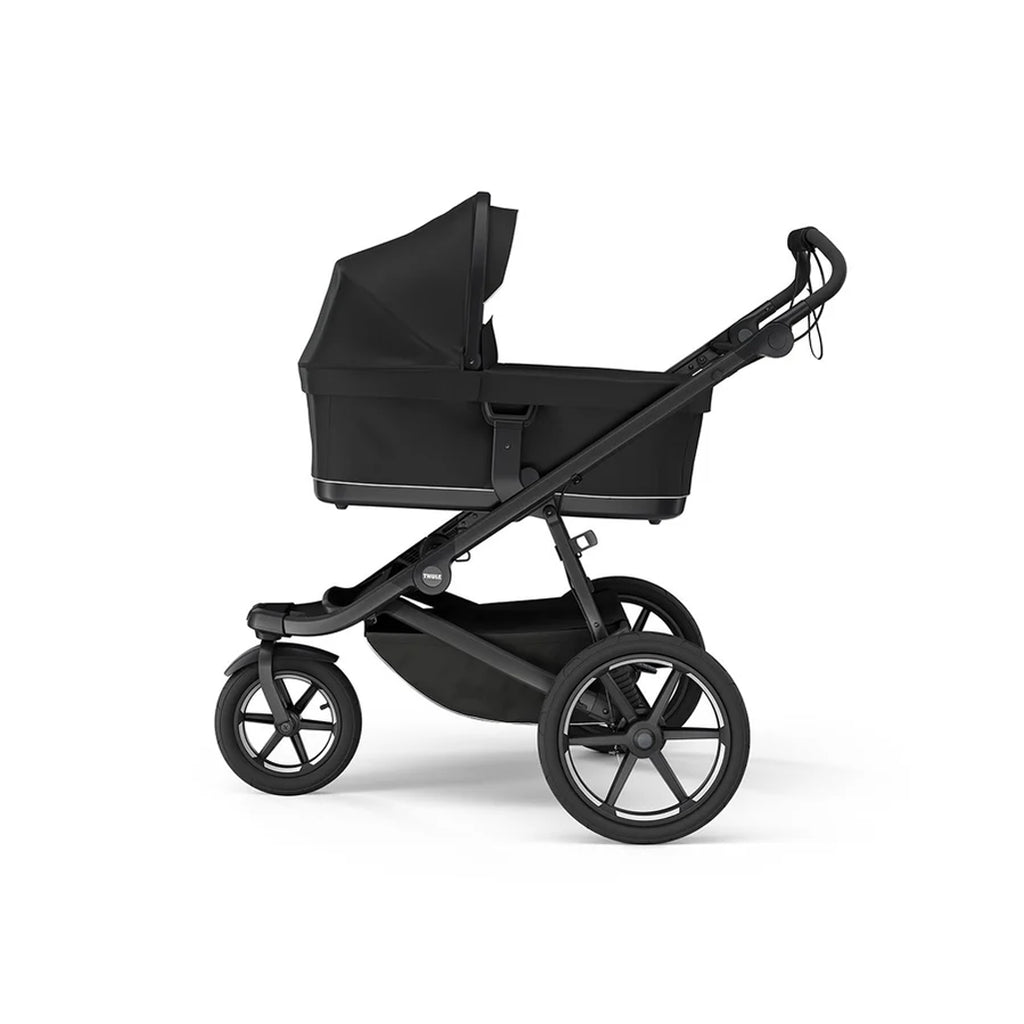 Thule black bassinet for strollers, offering a sleek look and comfortable design.