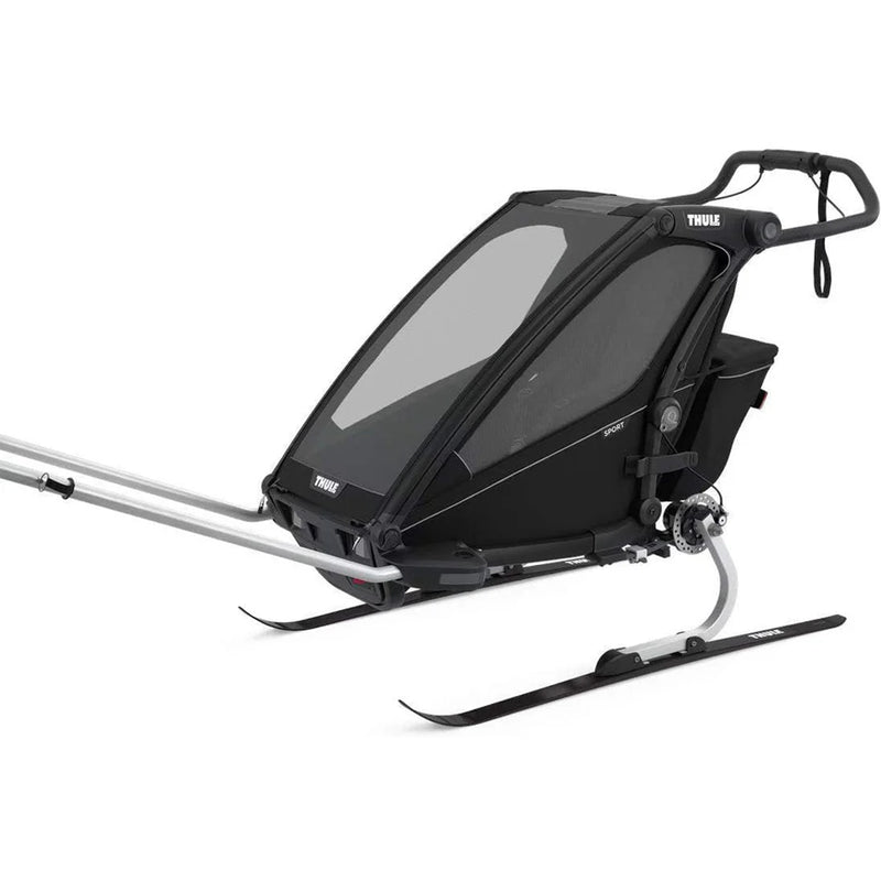 Thule Chariot Sport 1 children’s trailer on skis, for winter adventures.